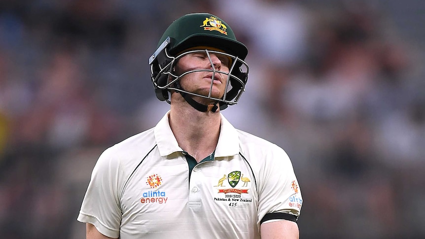 Australia batsman Steve Smith closes his eyes and looks forlorn as he leaves the field of play.