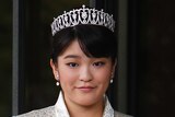 Japanese Princess Mako wears a silver formal dress with a diamond tiara crown and diamond teardrop flower earrings.