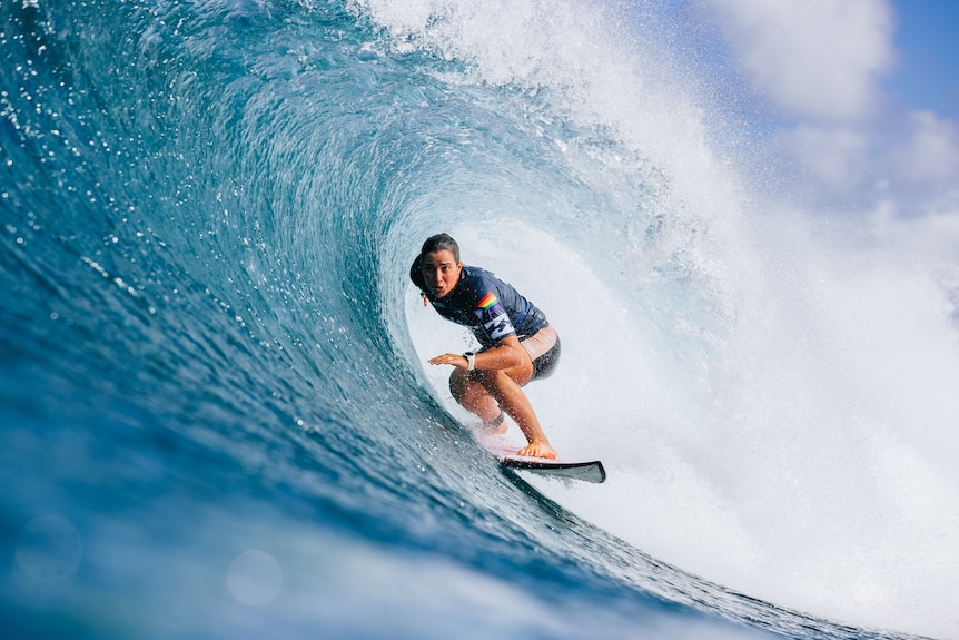 Tyler Wright is shown surfing at the Billabong Pro Pipeline