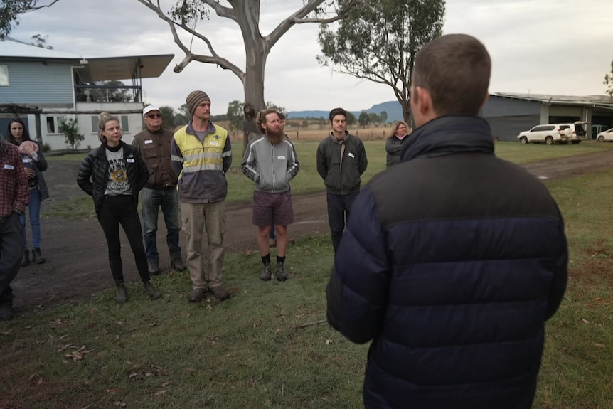 Photo of a group of people talking.