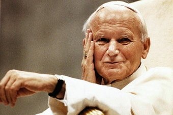 Pope John Paul II wearing a white outfit