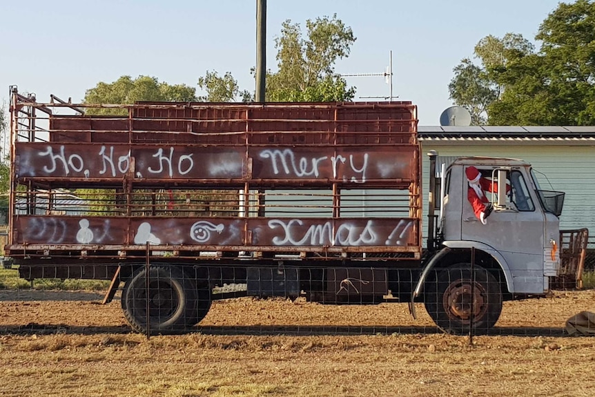 Santa driving a truck as part of a display contest in Isisford, Queensland