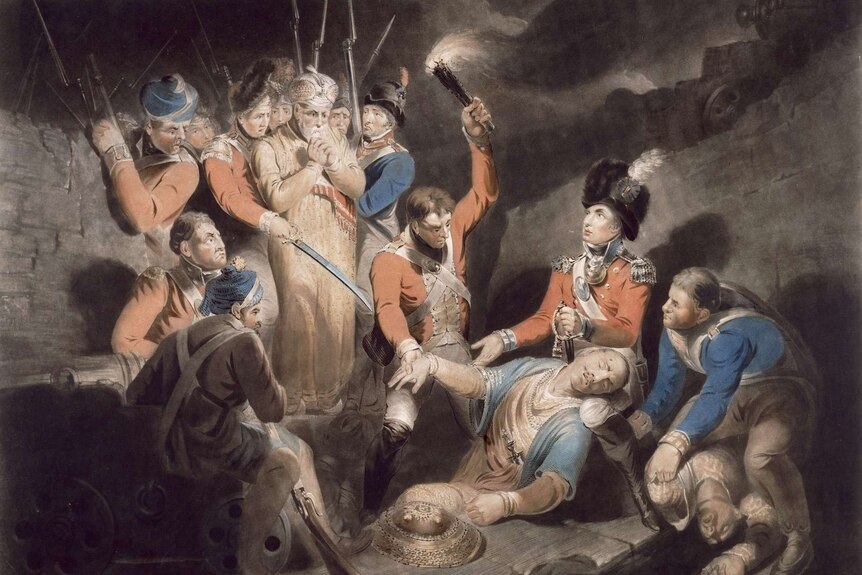 An illustration of British soldiers finding the body of Tipu Sultan, one holds a torch to illuminate the scene.