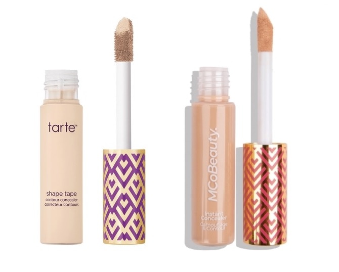 Two concealer bottles and wands against a white background.