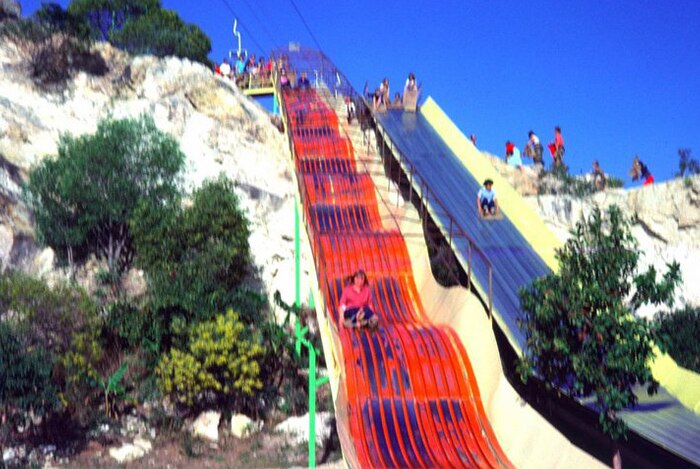 Kids use a slide at Magic Mountain, Gold Coast, in the 1980s
