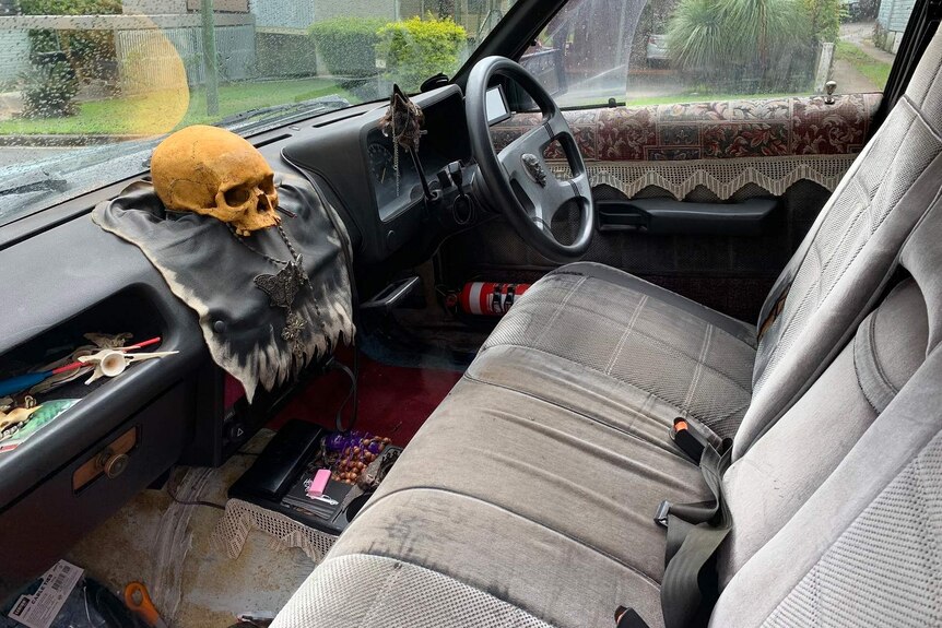 The interior of a car that has been transformed into a house of horrors.