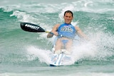 Ironman Dean Mercer in the waves on a surf ski at Main Beach on the Gold Coast in December 2003.