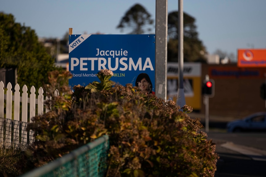 A blue election sign reads 'Jacquie Petrusma'