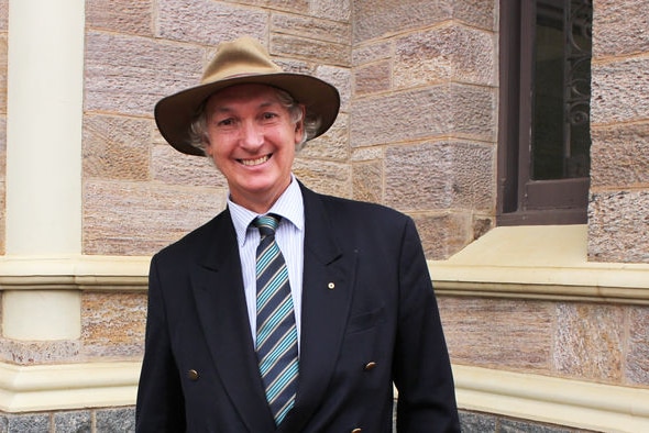 a man with an akubra hat on