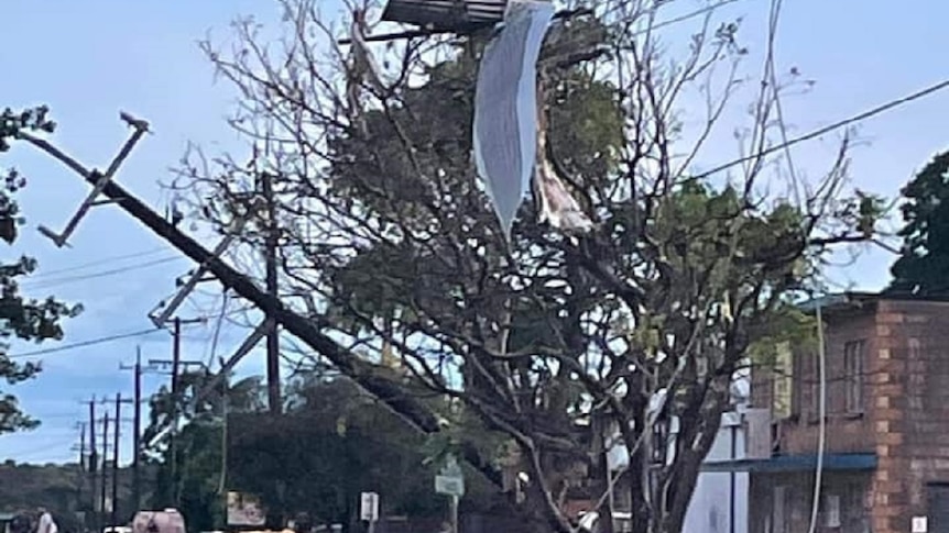 storm debris, power lines down, twisted metal