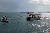 Search and rescue boats at sea off the Mersing coast of Malaysia, with flags on one of the boats