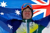 Jarryd Hughes celebrates his snowboard cross silver medal with the Australian flag in Pyeongchang.