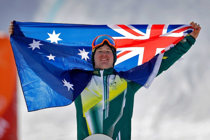 Jarryd Hughes celebrates his silver medal with the Australian flag