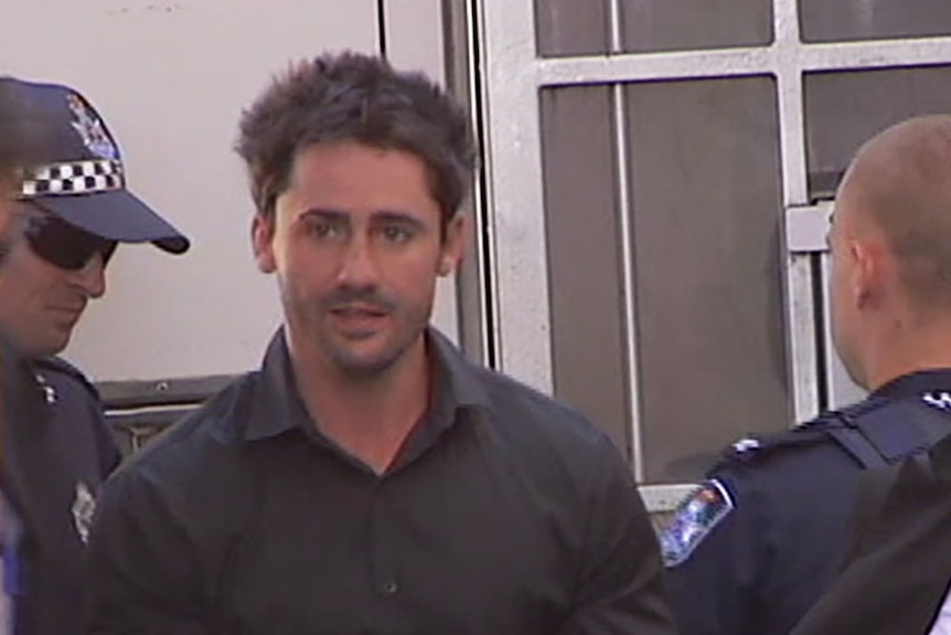 Daniel Heazlewood steps out of a Queensland police van in 2015