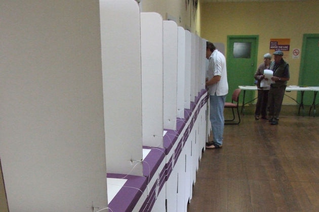 First voter fills out ballot paper