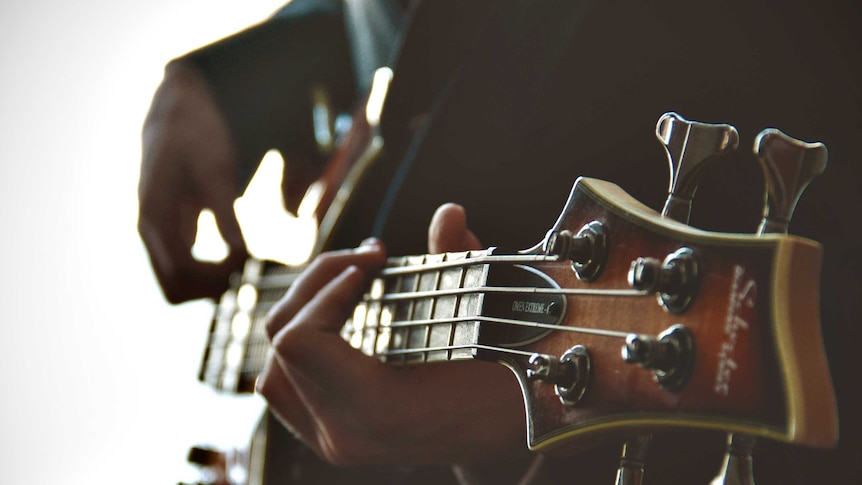 Man playing guitar.