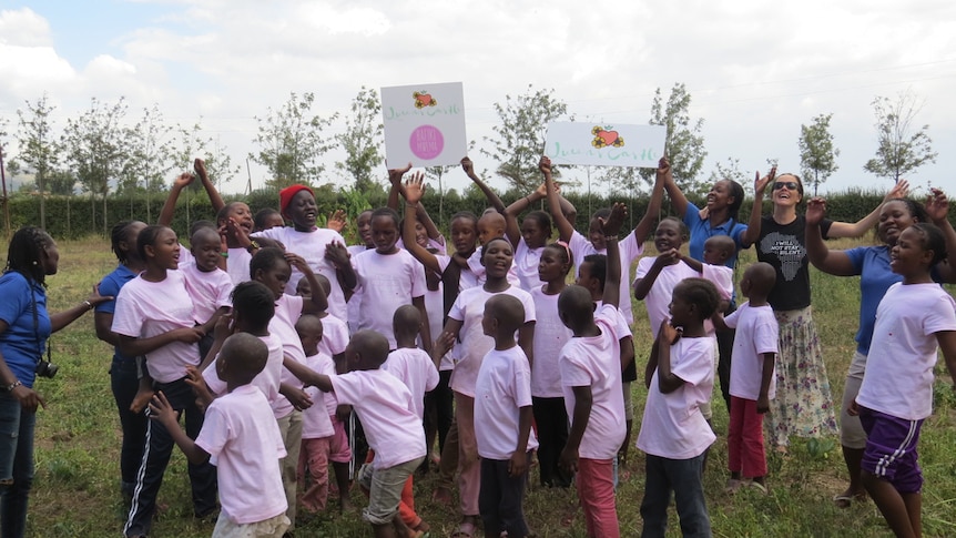 Children cheering with Sarah Rosborg