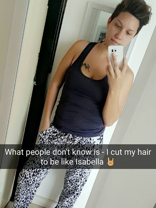 A snapchat selfie of a woman in a mirror titled 'what people don't know is - it cut my hair to be like isabella'