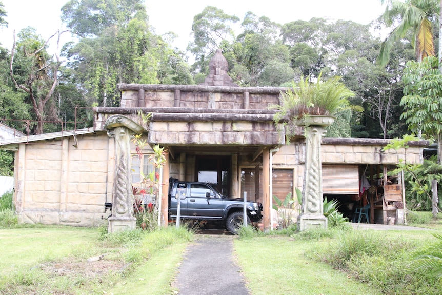 Old ancient building in the rainforest with faux stone and turrets