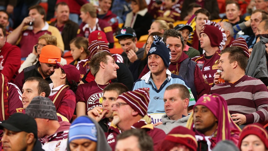 Tough spot ... a Blues fan braves the Maroon masses at Lang Park on Wednesday night.