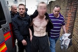 Thousands of arrests... Police lead a man away following a raid on a property in Pimlico, London.