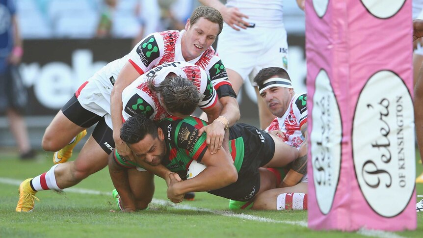 South Sydney's John Sutton scores a try against St George in the NRL Charity Shield.