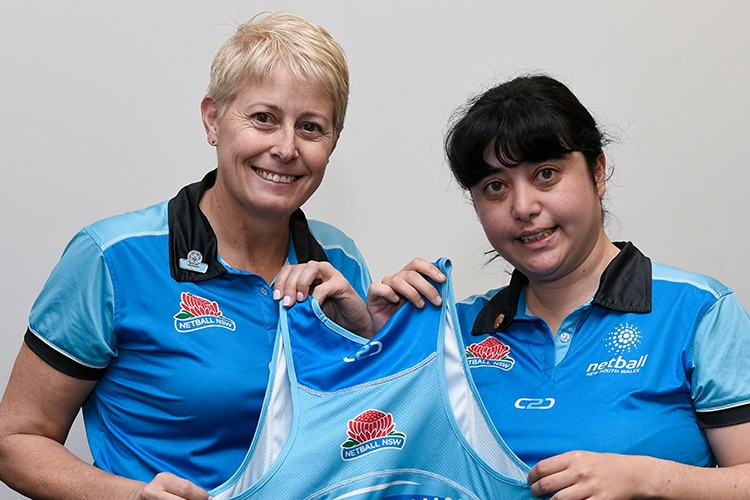 Ellison and Sirivivatnanon wear their NSW blue training tops and hold up Sirivivatnanon's NSW dress on selection day
