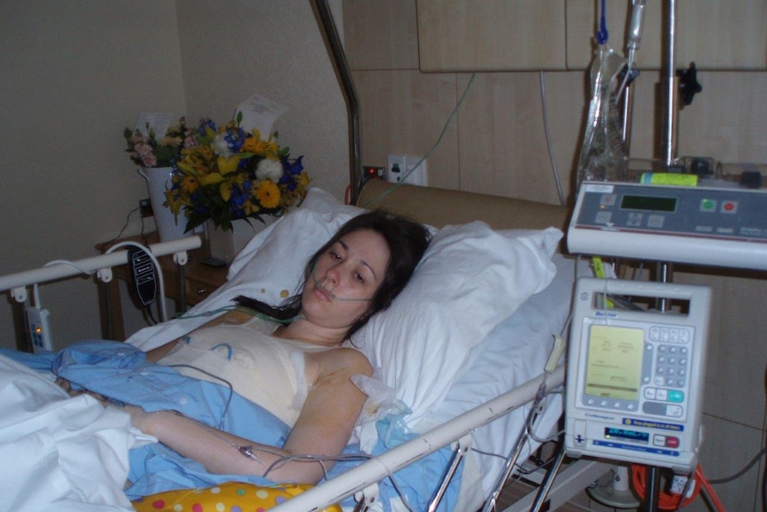 Krystal in hospital bed post double mastectomy