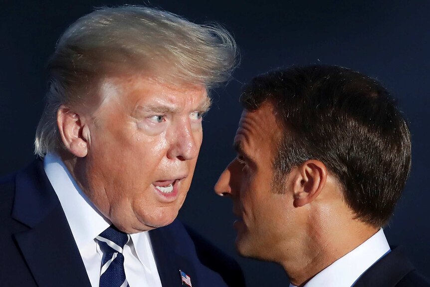 US President Donald Trump talks to French President Emmanuel Macron.