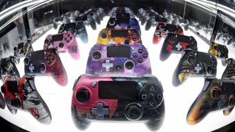A multi-coloured array of video game handsets.