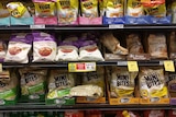 Packets of colourful chips line supermarket shelves