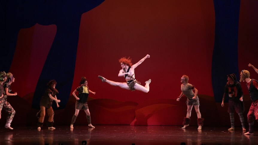Male ballet dancer performs onstage.