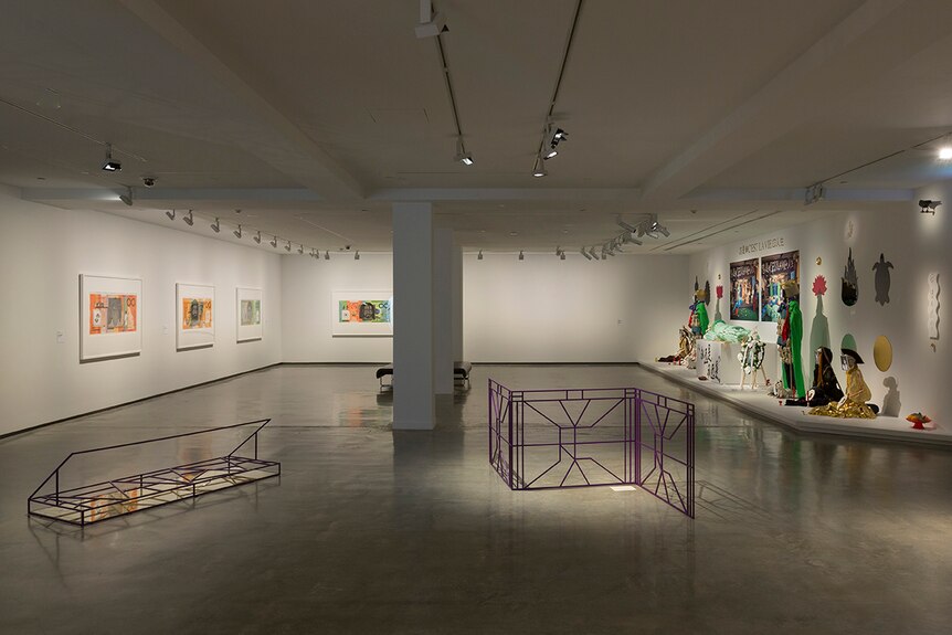 Colour photograph of artist Spence Messih's purple steel sculptures and other artworks inside the Museum of Contemporary Art.