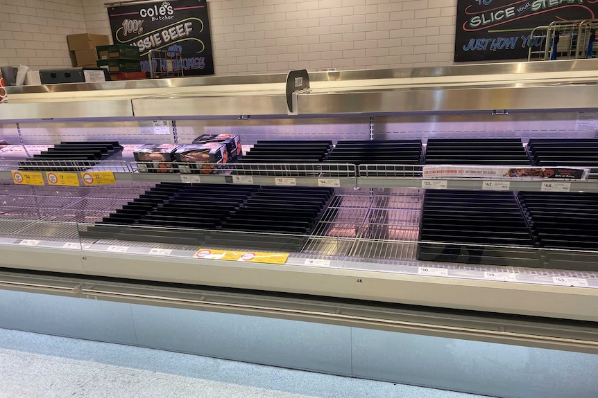 Empty shelves in the meat department at a Coles supermarket.