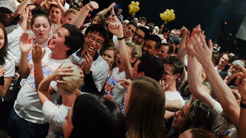 Labor volunteers celebrate after being mentioned in Kevin Rudd's speech.