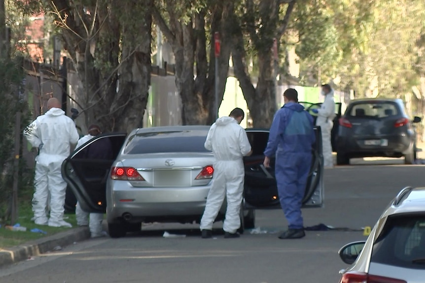 police and forensic officers at the secne of a shooting