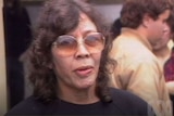 A close up of a woman wearing glasses