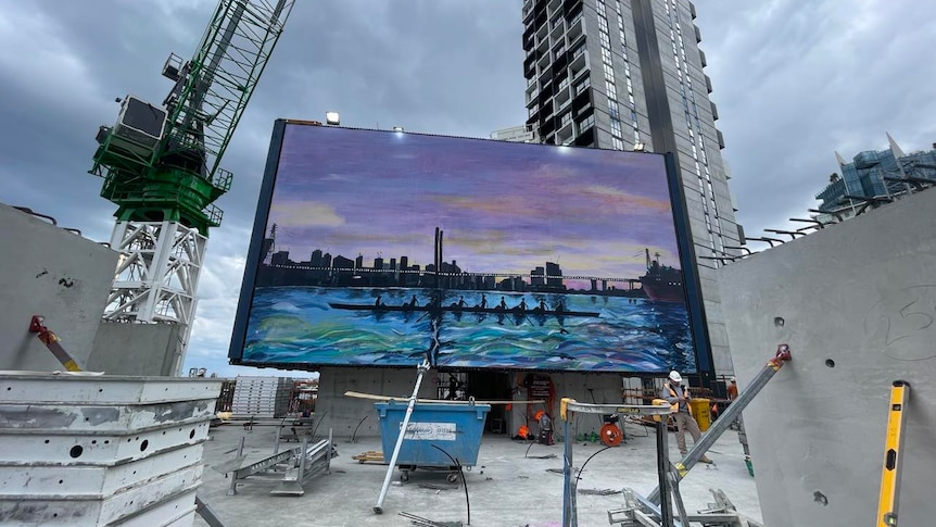 A large artwork dispalyed within a construction site
