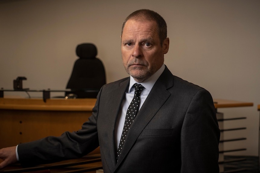 Coroner Simon Cooper looking serious.