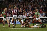 The Rabbitohs' Sam Burgess reacts after his brother George is tackled by Manly's Steve Matai.