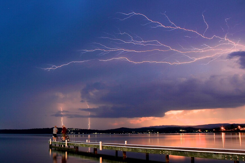 Lightning streaks across the sky as a storm approaches Lake Macquarie.