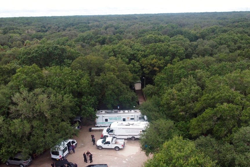 A police command post in dense bushland.