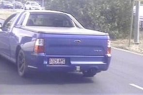 A blue 2011 Ford Falcon utility.
