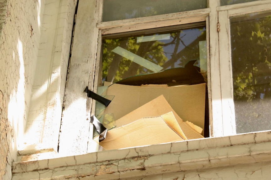 A broken window in a building.
