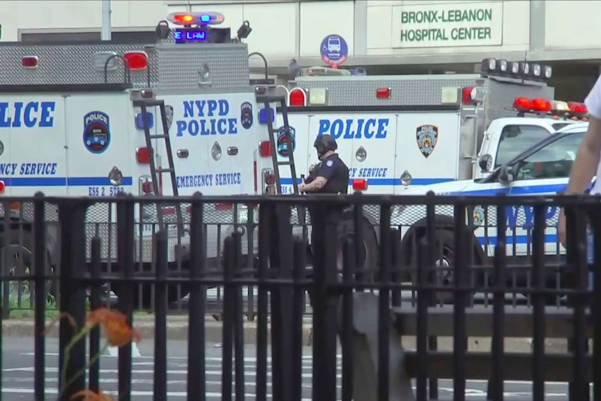NYPD police vans and emergency personnel converge on Bronx Lebanon Hospital in New York.