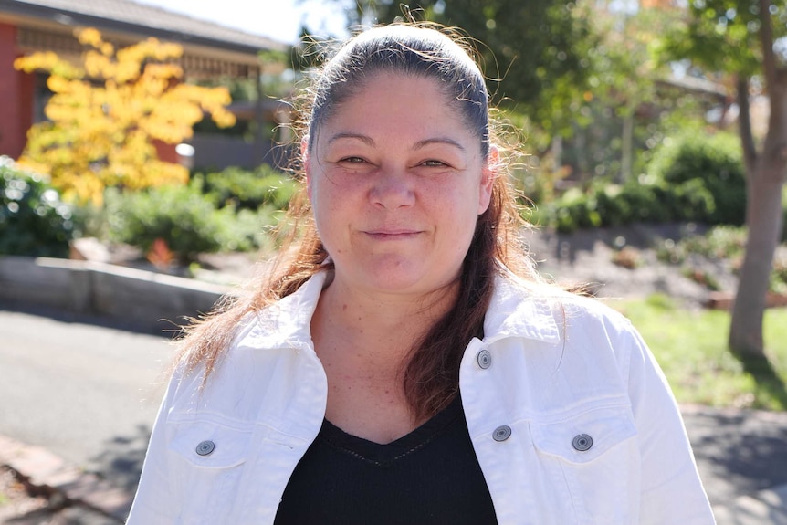 Helen Buckley stands outside her house in Ngunnawal, Canberra