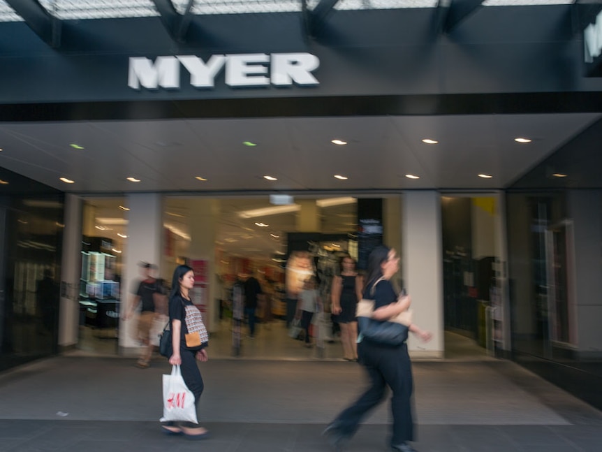 Shoppers walk past Myer in Melbourne.