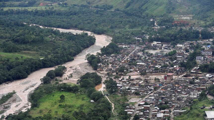 An aerial view shows a flooded area after heavy rains caused several rivers in Colombia to overflow.