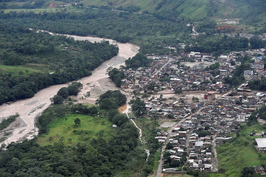 An aerial view shows a flooded area after heavy rains caused several rivers in Colombia to overflow.