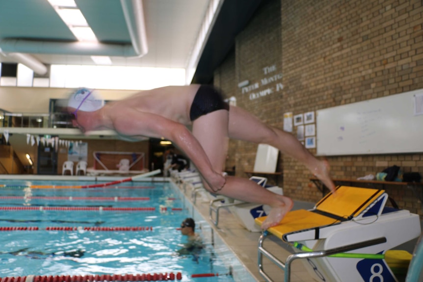 Swimmer on starting block